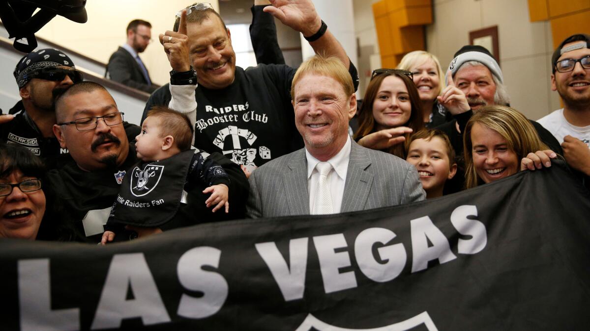 Raiders owner Mark Davis, center, meets with Raiders fans in Las Vegas.