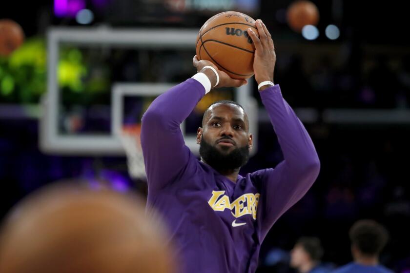 Los Angeles Lakers forward LeBron James shoots during warmups.