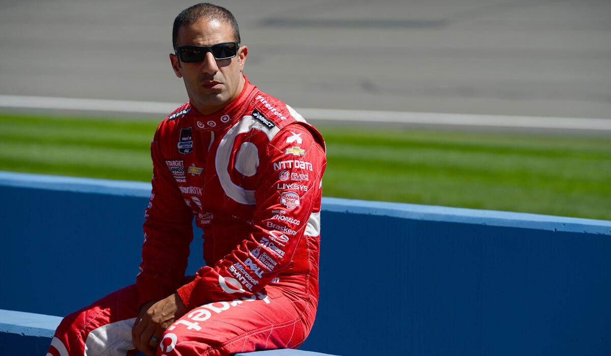 IndyCar driver Tony Kanaan relaxes during qualifying for the MAVTV 500 last week at Auto Club Speedway in Fontana.