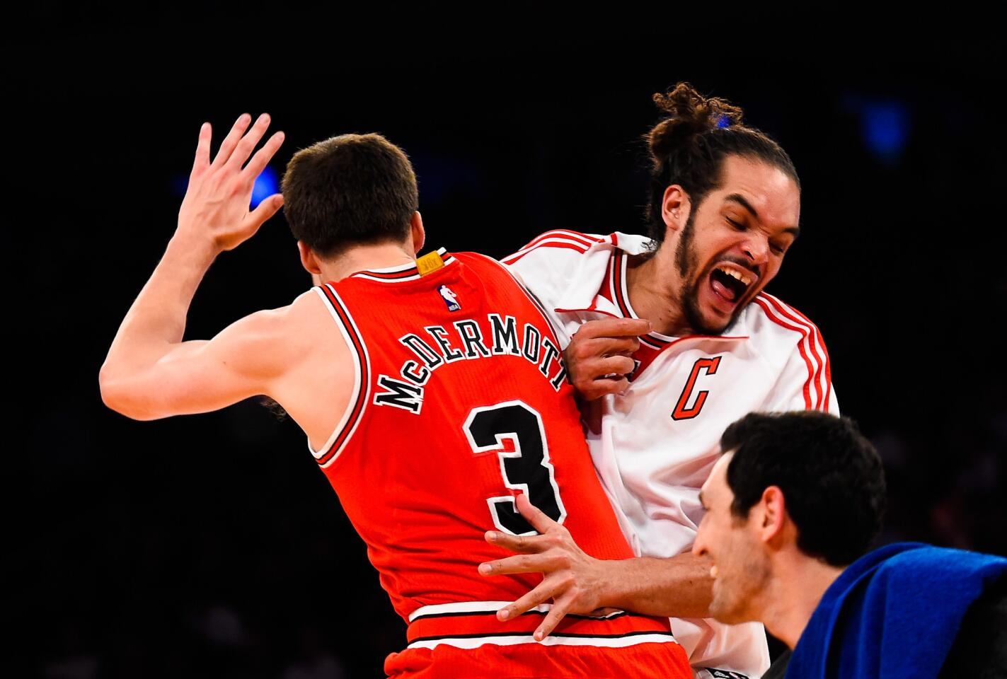 Joakim Noah celebrates with Doug McDermott after a play in the fourth quarter.