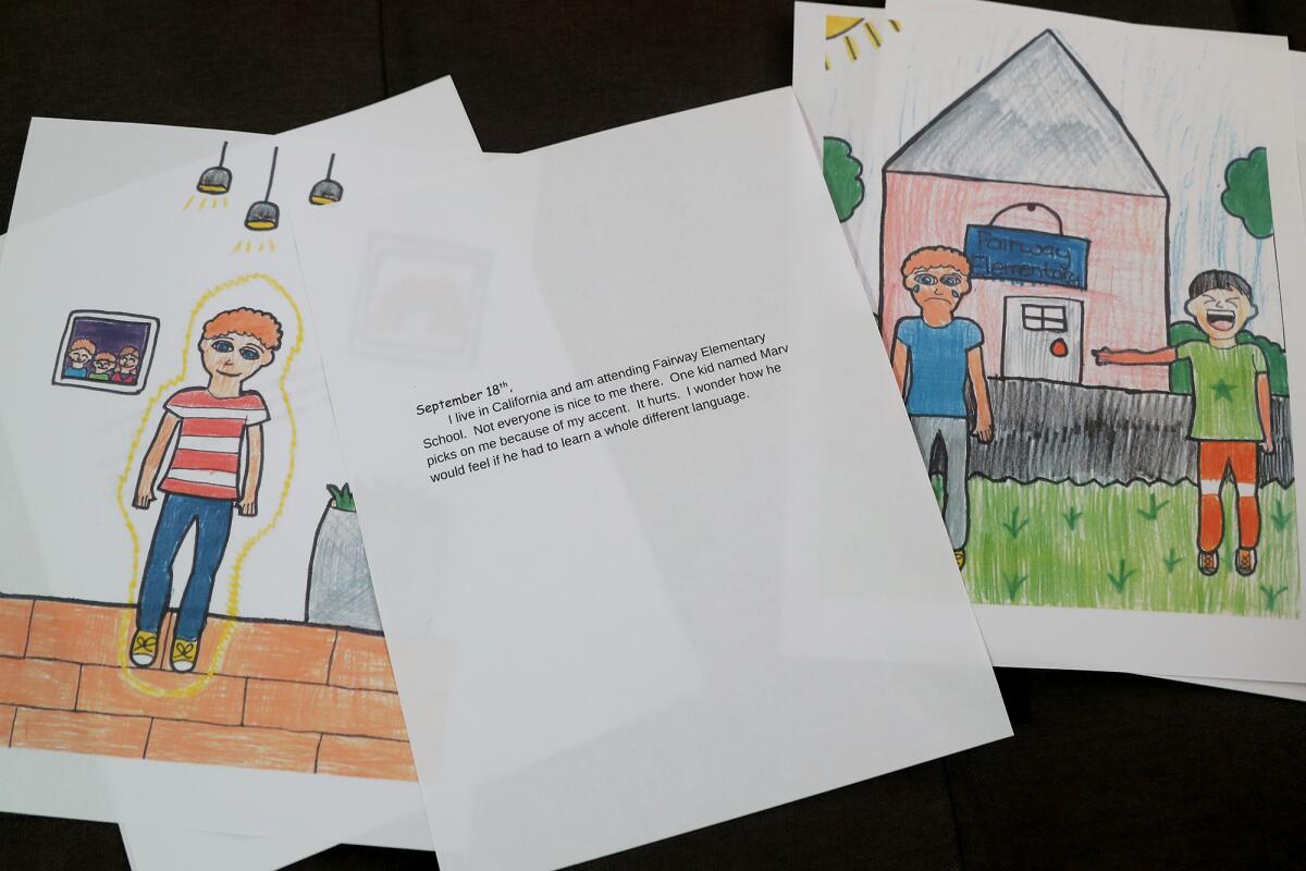 Pages showing text and artwork created by the Troutman children for their anti-bullying book.