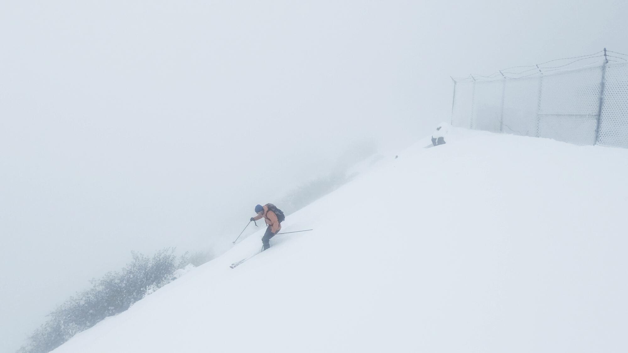 Preston Lear begins his descent from the fog-shrouded summit of Mt. Lukens.