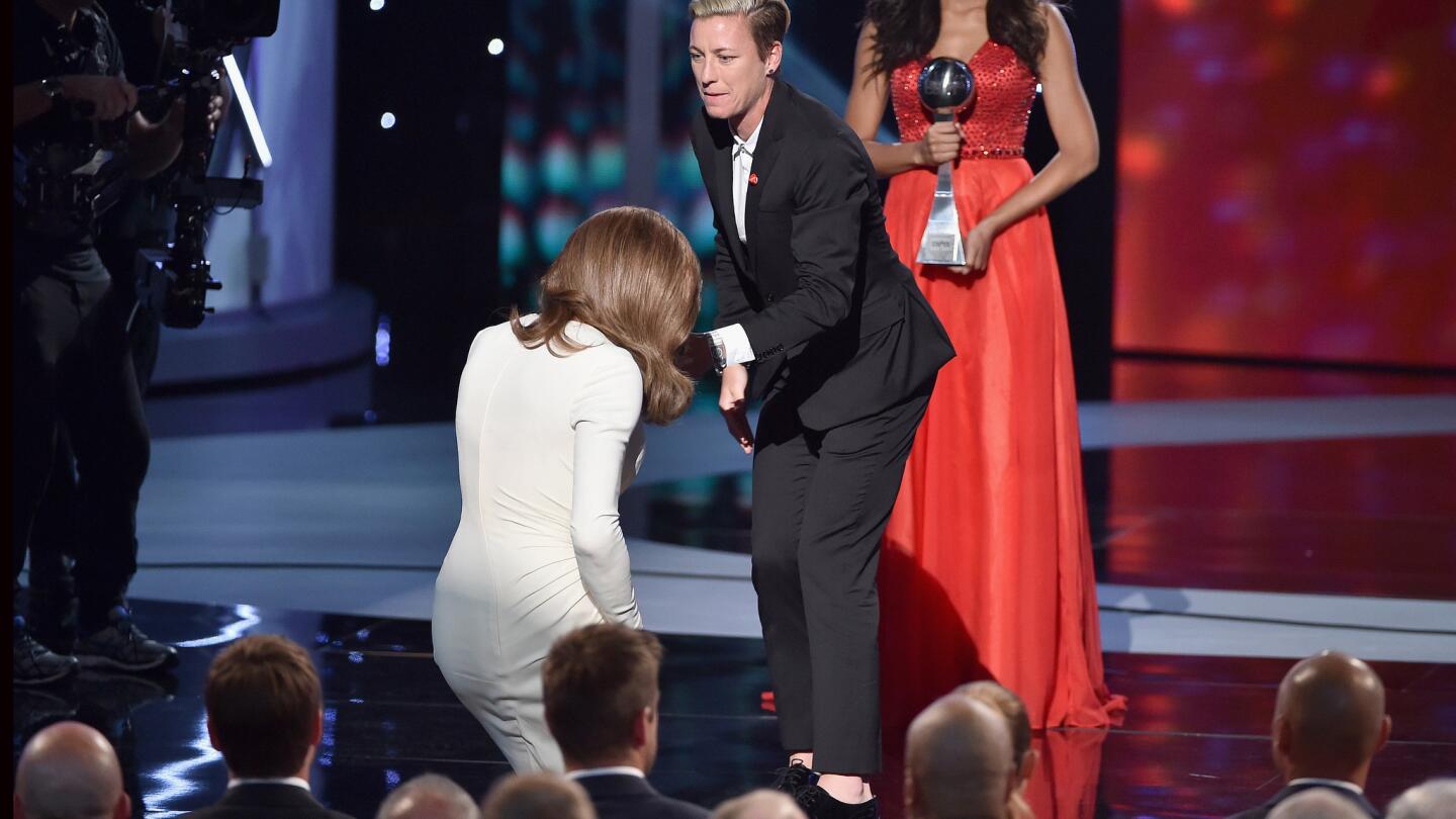 Women's pro soccer player Abby Wambach helped Jenner onstage.