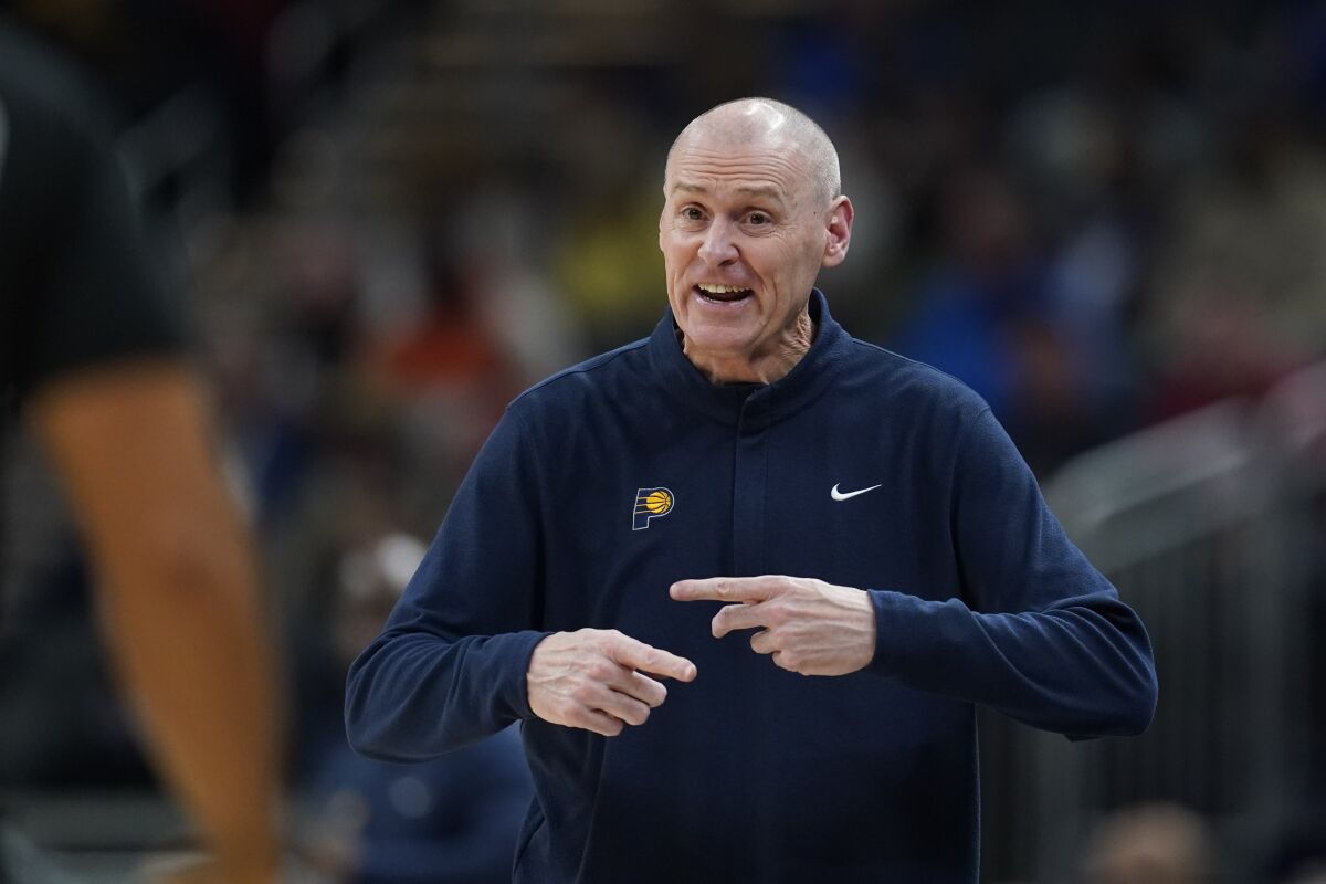 Indiana Pacers coach Rick Carlisle argues a call during the first half of the team's NBA basketball game against the New York Knicks, Wednesday, Dec. 8, 2021, in Indianapolis. (AP Photo/Darron Cummings)