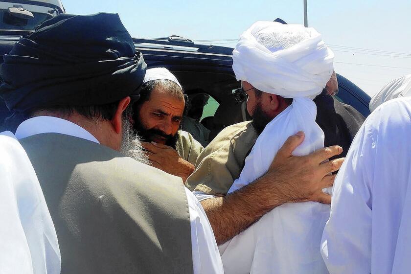 A man reported to be Mohammed Fazl, former chief of staff of the Taliban army, is welcomed at an undisclosed location in Qatar. He is considered the most dangerous of the five Taliban members freed by the U.S. last week.