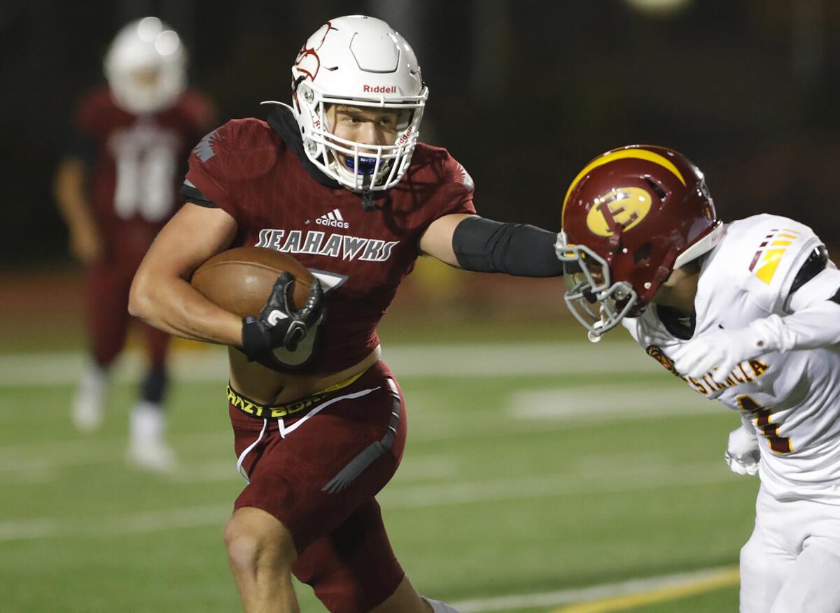 Ocean View High running back Anthony Ramirez runs to the outside for a big gain against Estancia.