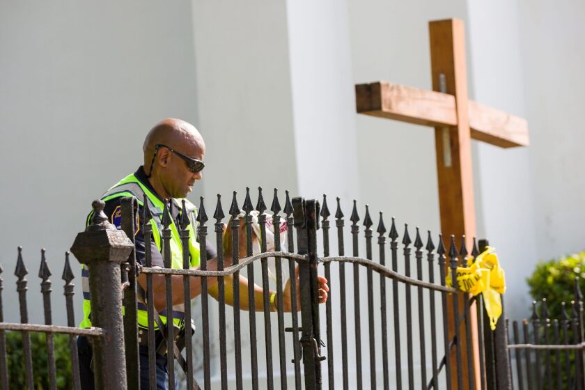 Charleston police work outside the Emanuel African Methodist Episcopal Church, where a gunman killed nine people at a prayer meeting, in Charleston, S.C., on June 19.
