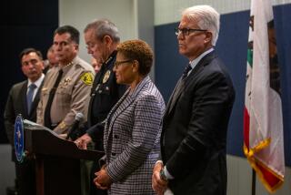 Los Angeles, CA - Los Angeles Sheriff Robert Luna, LAPD Chief Michel Moore, Los Angeles Mayor Karen Bass, and Dist. Atty. George Gascon speak during a press conference regarding the homicides of three homeless individuals on Saturday, Dec. 2, 2023, in Los Angeles, CA. A suspect was arrested in connection with a series of shootings that left three homeless men dead across Los Angeles in the past week, police announced Saturday. Suspect Jerrid Joseph Powell, 33, is also suspected of responsibility for a separate killing in a follow-home robbery in San Dimas, Police Chief Michel Moore said at an afternoon news conference. (Francine Orr / Los Angeles Times)