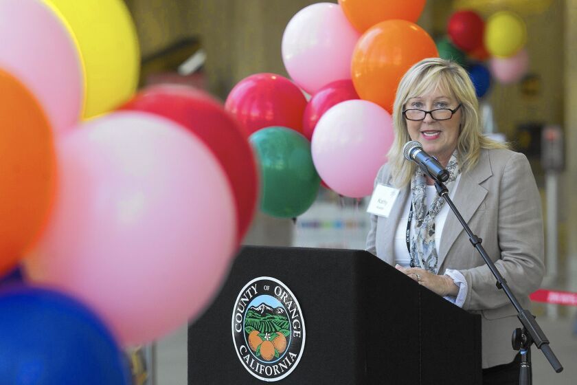 Kathy Kramer, CEO of the OC Fair & Event Center, speaks during a celebration Wednesday for "Fair Play," a new exhibit about the fair on display at John Wayne Airport.