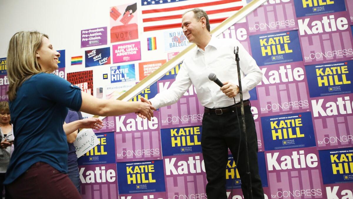Rep. Adam B. Schiff greets Katie Hill, a Democrat who ousted a Republican incumbent in Los Angeles County, at a campaign event before the midterm election.
