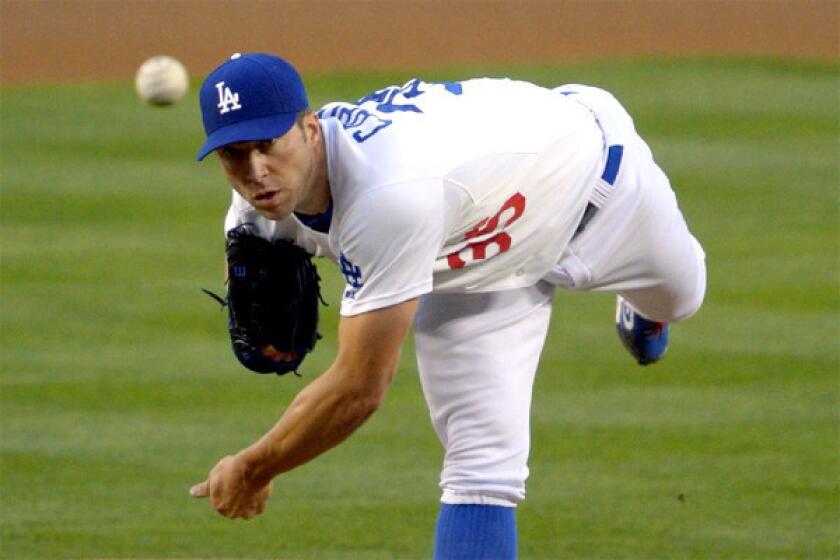 Chris Capuano made his first start in place of Zack Greinke on Tuesday, but left after two innings with a strained calf.
