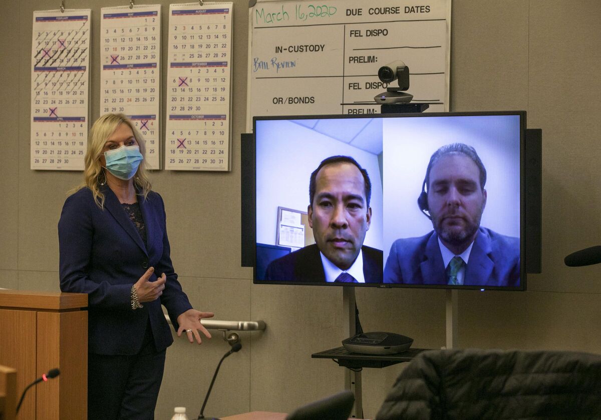Presiding judge Lorna Alskne, left, held the first video court case in San Diego under the new COVID-19 pandemic on Monday. April 6, 2020. After the hearing and off the bench she answered questions from the media along with Deputy Public Defender Matthew Wechter, right of the screen, and Deputy District Attorney David Grapilon on the left.