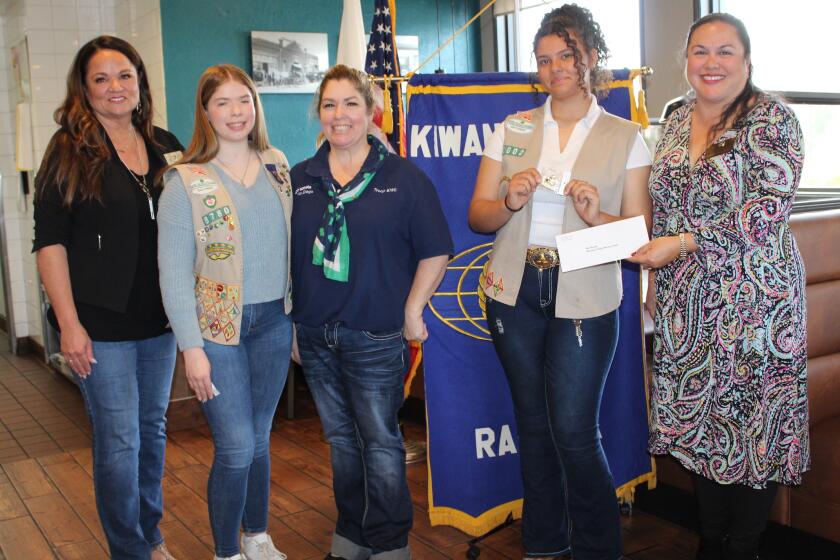 Kiwanis Club of Ramona's Tiffany Lynch, right, presents a check for $400 to the Ramona Girl Scouts Sun Valley Service Unit.  