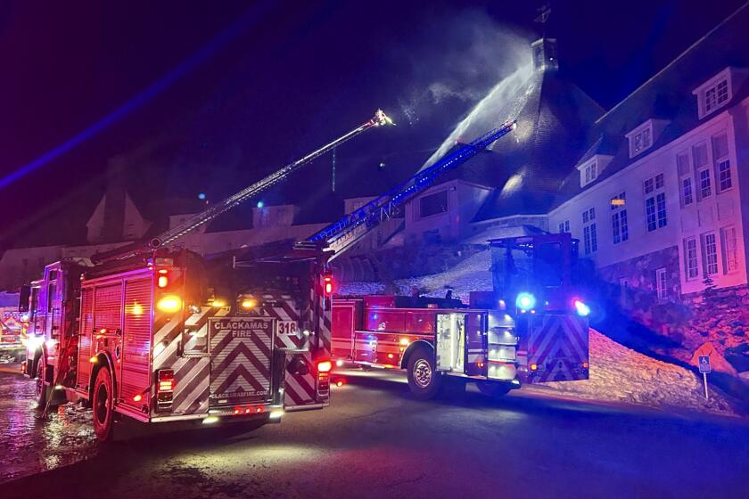 Firefighters extinguish a fire at Oregon's historic Timberline Lodge, which was featured in Stanley Kubrick's 1980 film "The Shining," Thursday evening, April 18, 2024, in Government Camp, Ore. (Clackamas Fire Department via AP)