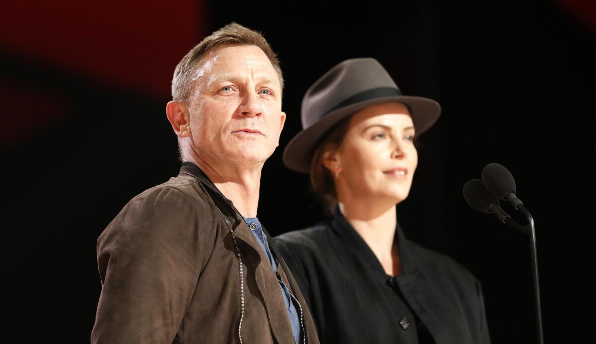 Daniel Craig and Charlize Theron onstage during Saturday rehearsals in the Dolby Theatre as preparations continue for the 91st Oscars.