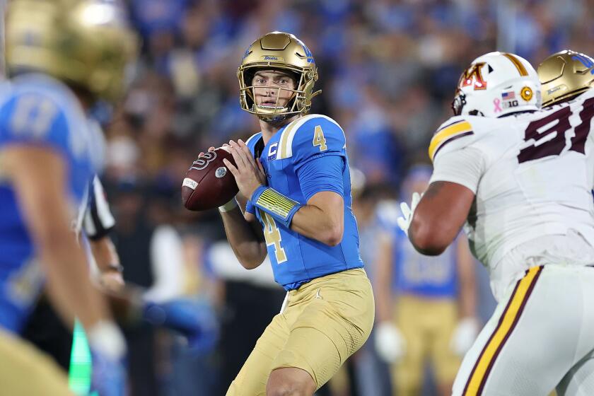 UCLA quarterback Ethan Garbers looks to pass against Minnesota in the first half Saturday at the Rose Bowl.