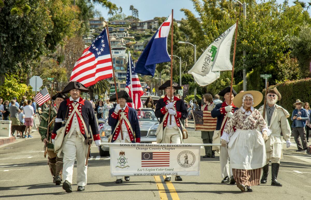 The Orange County Sons of the American Revolution march in the Laguna Beach Patriots Day Parade in 2020.