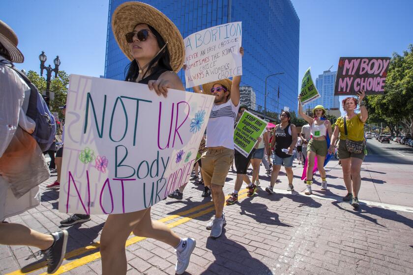 Los Angeles, CA - June 25: Protesters march down First Street during one of two abortion rights protests, including a second one that was called the ``Rock for Abortion Rights", and included a concert, rally and march outside the U.S. Federal Courthouse in Los Angeles on Saturday, June 25, 2022. (Allen J. Schaben / Los Angeles Times)