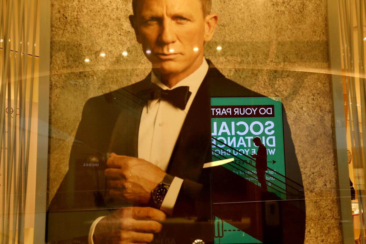 A poster promotes Omega watches and the new James Bond film featuring Daniel Craig, 'No Time to Die.'