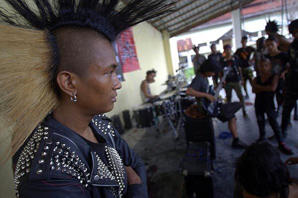 A group of punkers during a punk music concert before being arrested by police in Banda Aceh.