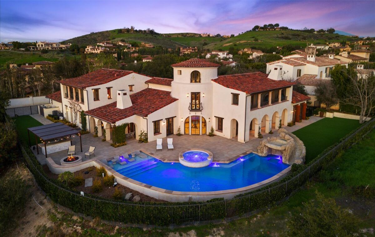 Built in 2010, the four-story mansion includes a decked-out pool complete with a slide, waterfall and rock grotto.