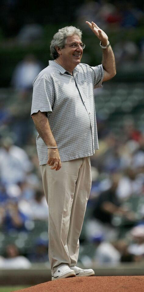 Harold Ramis waves to the crowd before throwing a ceremonial first pitch before the Chicago Cubs take on the Philadelphia Phillies at Wrigley Field in August 2006.