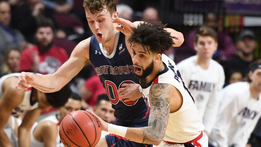 Gonzaga's Josh Perkins, left, steals the ball from Saint Mary's Tanner Krebs during the championship game of the West Coast Conference basketball tournament at the Orleans Arena on Tuesday in Las Vegas.