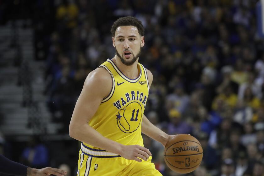 Golden State Warriors guard Klay Thompson plays against the Denver Nuggets.