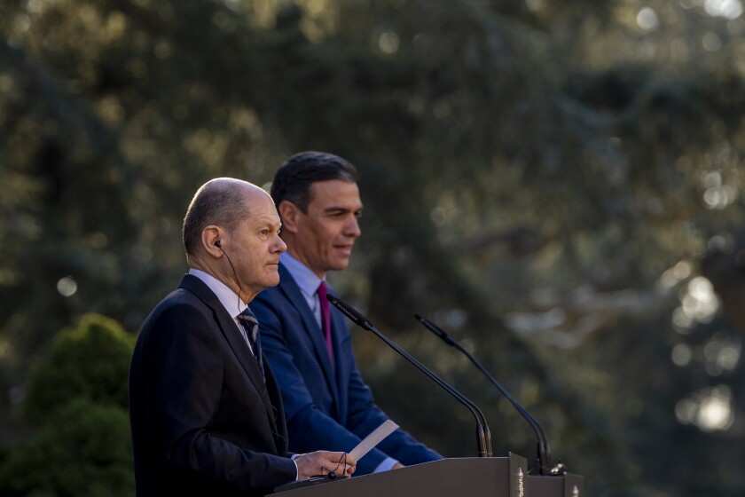 Spanish Prime Minister Pedro Sanchez, right, addresses the media next to German Chancellor Olaf Scholz after a meeting at the Moncloa palace in Madrid, Spain, Monday, Jan. 17, 2022. (AP Photo/Manu Fernandez)