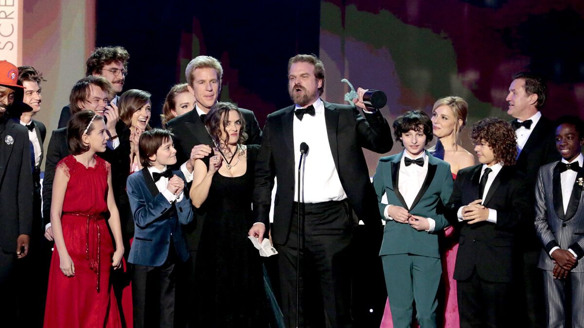 "Stranger Things' " David Harbour gives a speech as cast and crew look on.