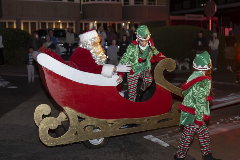 Santa and his elves arrive at Fletcher Cove at the Dec. 4 tree lighting event in Solana Beach.