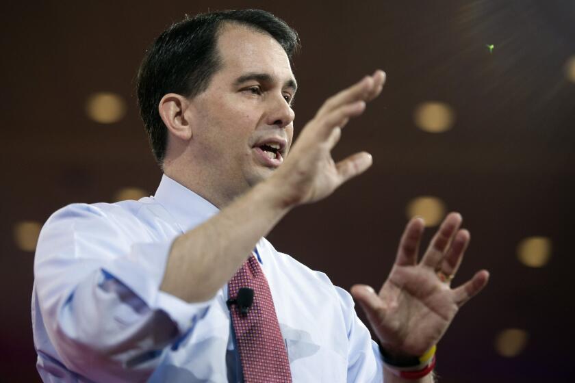 Wisconsin Gov. Scott Walker gestures while speaking during the Conservative Political Action Conference in National Harbor, Md.