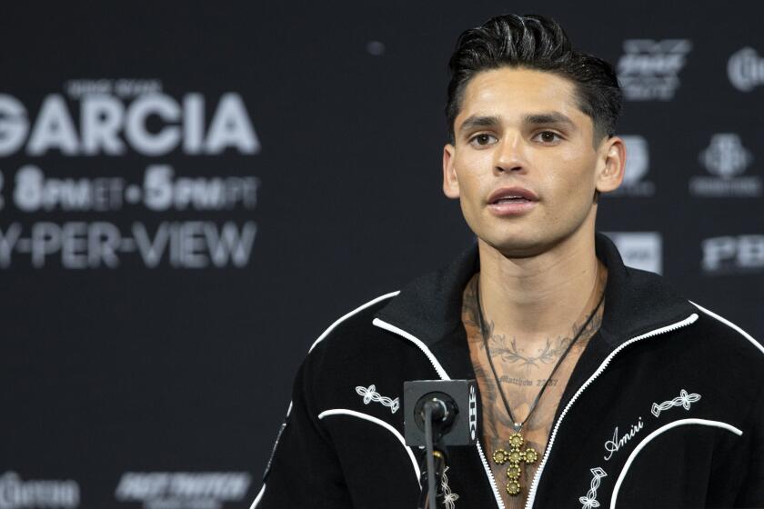 FILE - Super lightweight boxer Ryan Garcia speaks during a news conference.