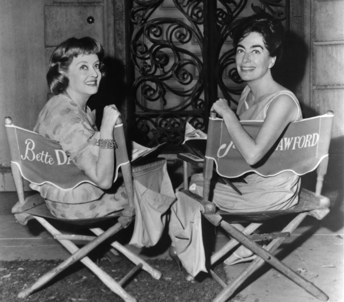 Bette Davis, left, and Joan Crawford in between scenes from the film "What Ever Happened to Baby Jane?" in 1962.