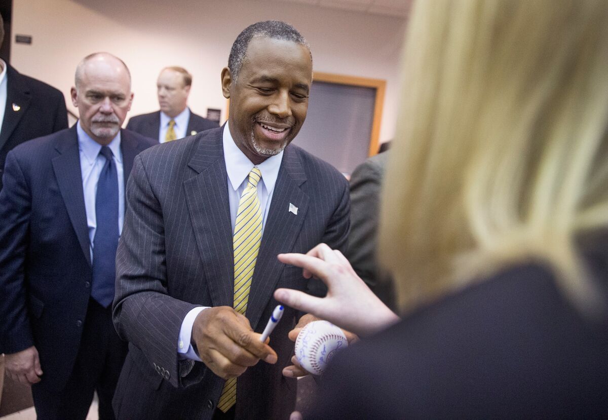 Republican presidential candidate Ben Carson greets guests at a barbecue over the weekend in Wilton, Iowa.