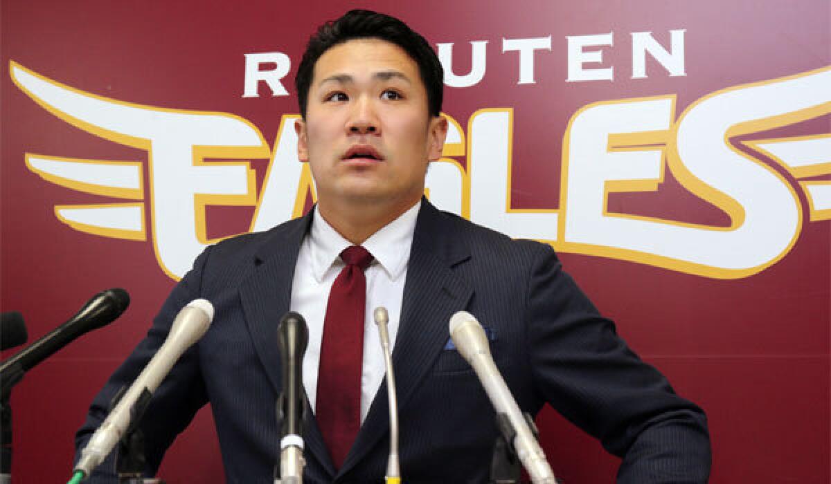 Japanese star pitcher Masahiro Tanaka of Rakuten Eagles speaks before the press after meeting with his team's president in Sendai in Miyagi prefecture, northern Japan on Tuesday.