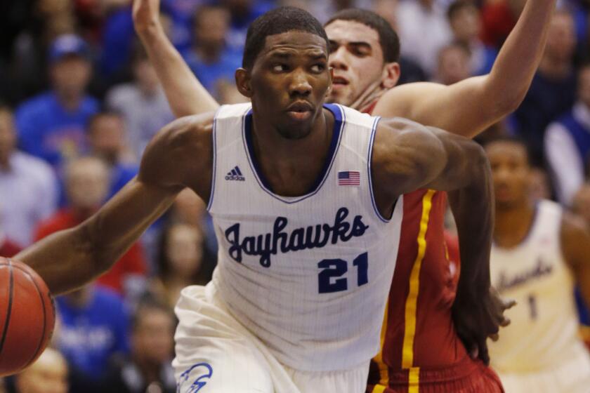 Kansas center Joel Embiid likely will fall in the draft order after undergoing foot surgery. Would the Lakers be willing to take a chance on him with the seventh-overall pick in the 2014 NBA draft?