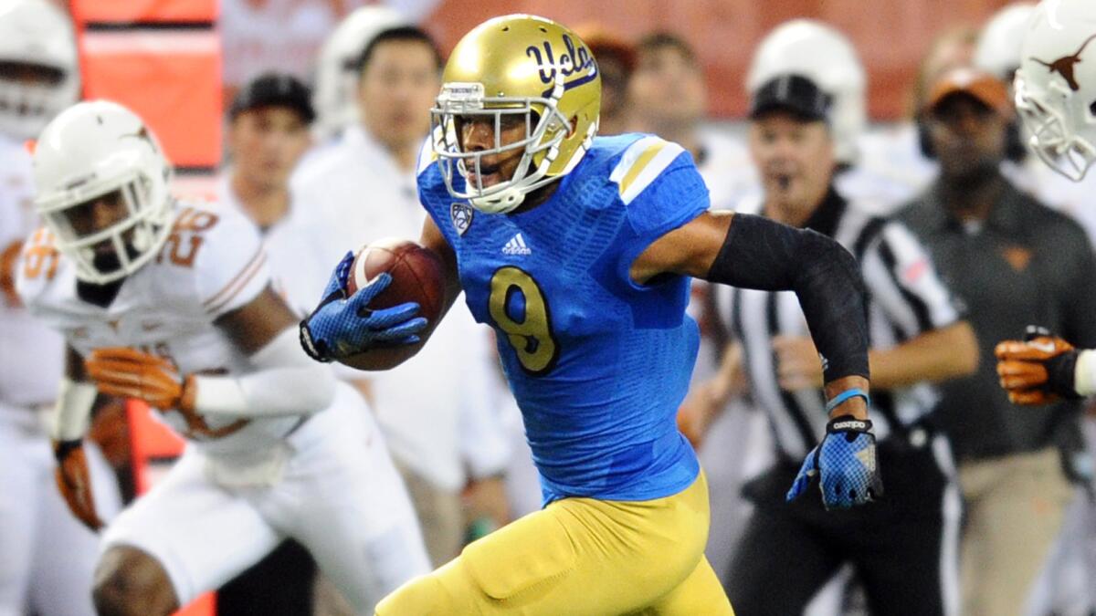 UCLA wide receiver Jordan Payton runs with the ball during the Bruins' win over Texas on Sept. 13. Watching the Bruins win in the Lone Star State was a treat for some UCLA fans.