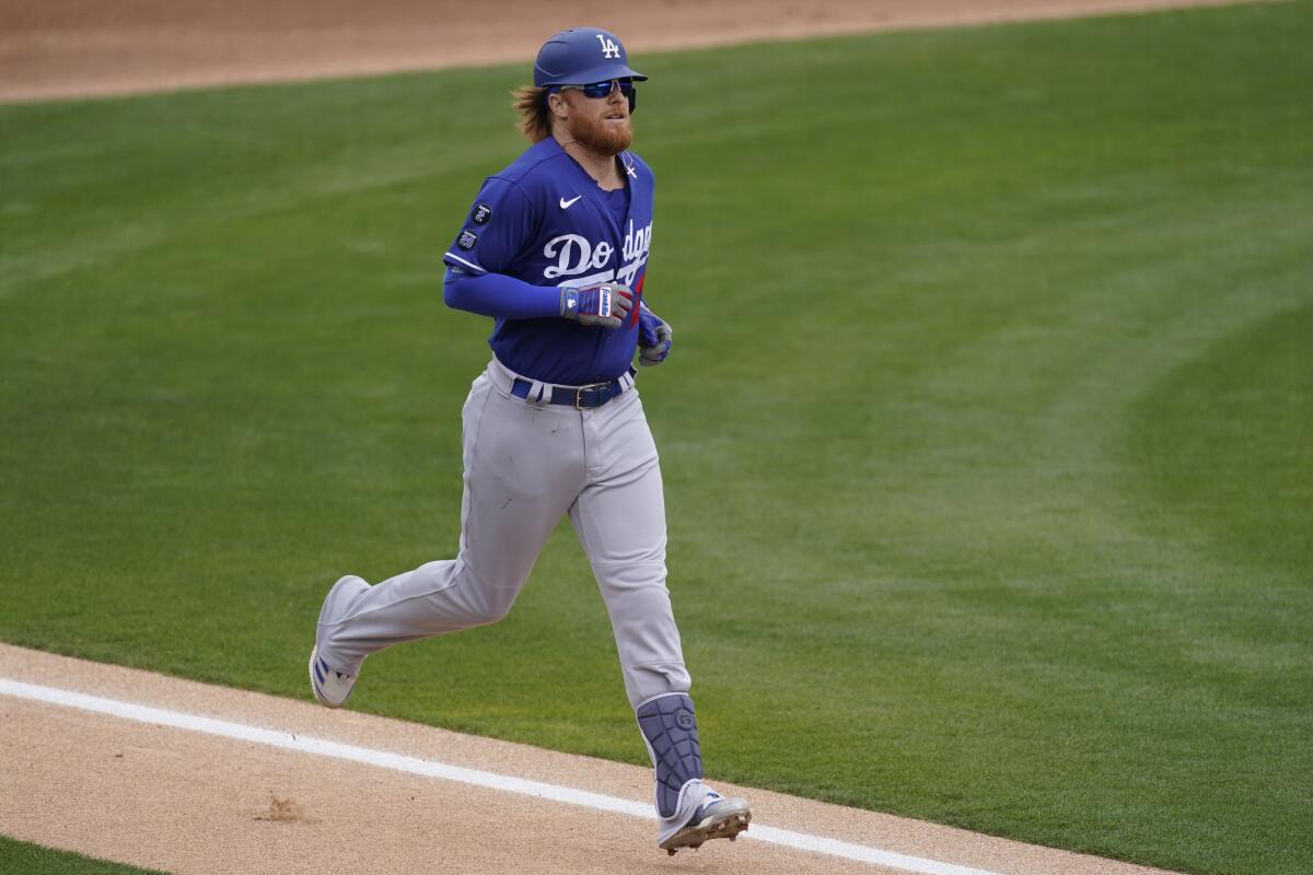 Los Angeles Dodgers' Justin Turner (21) stands at first base