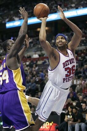 Pistons center Rasheed Wallace takes a shot against Kwame Brown.