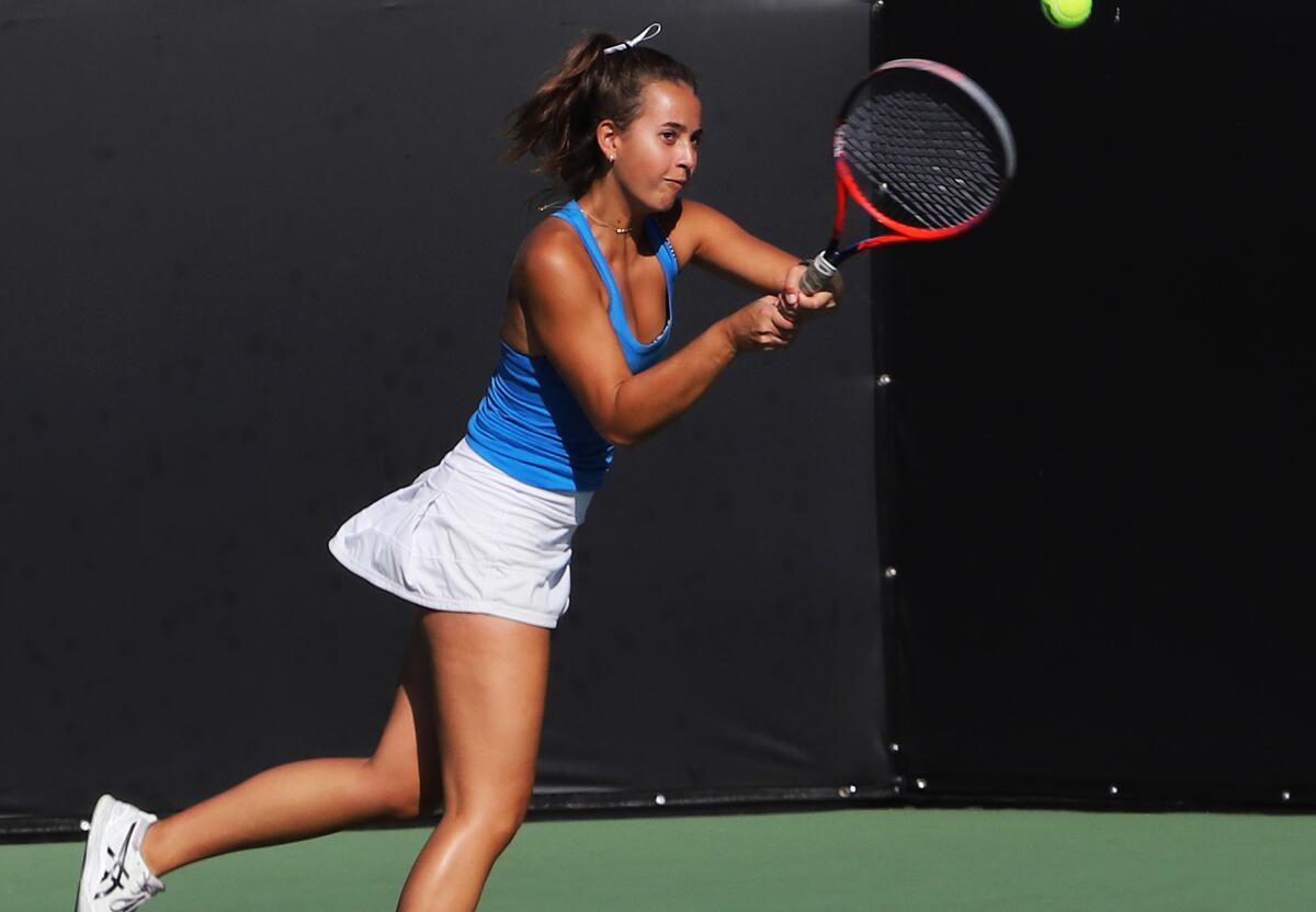 Corona del Mar's Cate Montgomery returns a backhand during play on Wednesday.