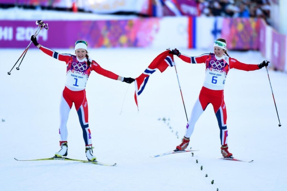 Maiken Caspersen Falla, left, of Norway and Ingvild Flugstad Oestberg of Norway celebrate finishing first and second.