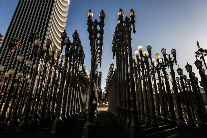LOS ANGELES, CA--FEBRUARY 8, 2017: Chris Burden's "Urban Light" installation at LACMA has become one of the city's most popular landmarks and tourist attractions - and it's celebrating its 10th birthday. For its' tenth anniversary they have announced that the display is now LED lights saving 90% of energy. (Maria Alejandra Cardona/ Los Angeles Times)