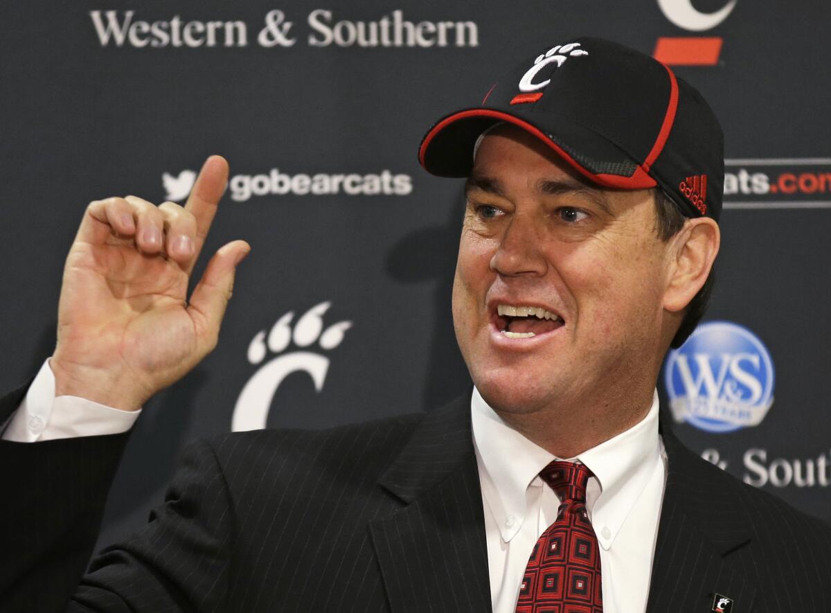 Mike Bohn speaks at a news conference after he was named Cincinnati athletic director in 2014.