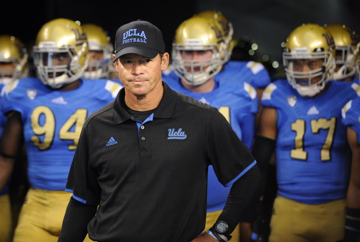 UCLA Coach Jim Mora and his team prepare to take the field against Texas on Sept. 13 at AT&T Stadium. The Bruins will face Arizona State on Thursday in Tempe, Ariz.