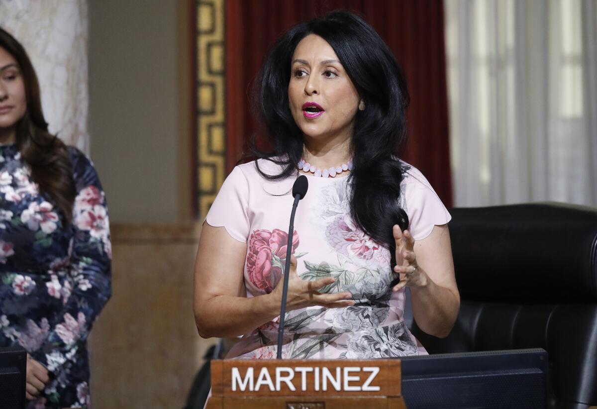 L.A. City Council President Nury Martinez talks in front of a microphone.