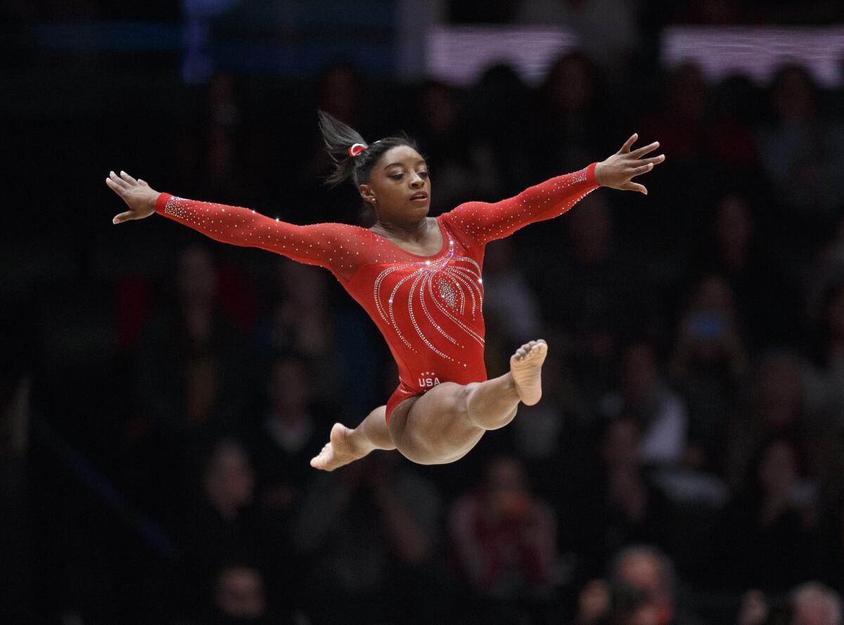 Simone Biles of the USA performs her floor routine during the team finals of the gymnastics world championships in Glasgow, Britain.