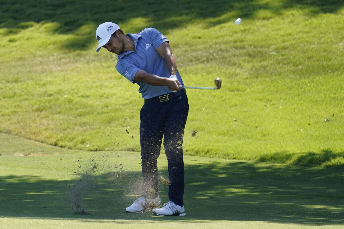 Xander Schauffele hits his second shot on No. 18 at the Charles Schwab Challenge in Fort Worth on June 13, 2020.