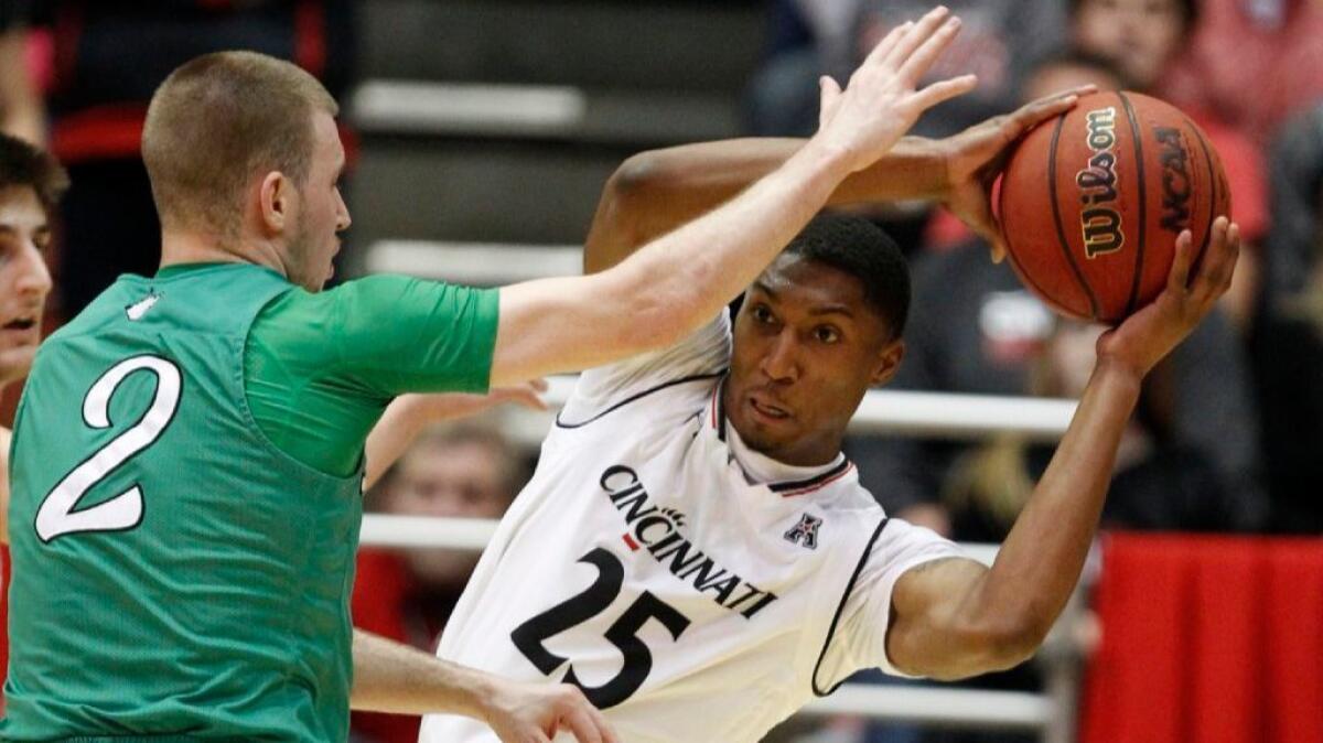 Cincinnati guard Kevin Johnson is pressured by Marshall guard Stevie Browning during the second half of a game on Dec. 22.