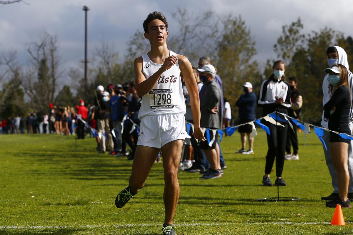 Laguna Beach's Mateo Bianchi finishes first for the Surf League boys in the cross-country finals.